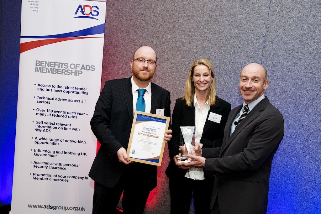 Vicky brown and Craig Baker collecting the bronze SC21 award